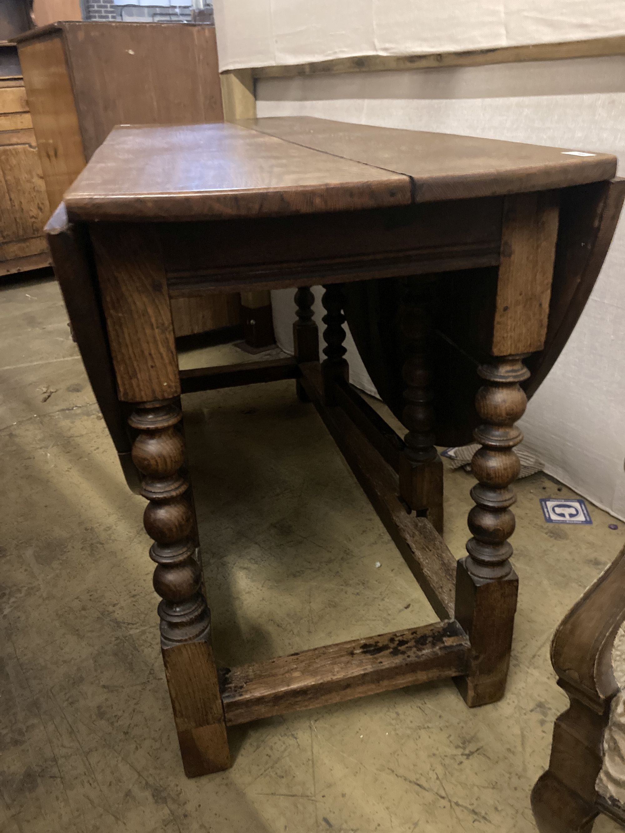 An 18th century oak gateleg dining table, 159cm extended, width 140cm height 78cm